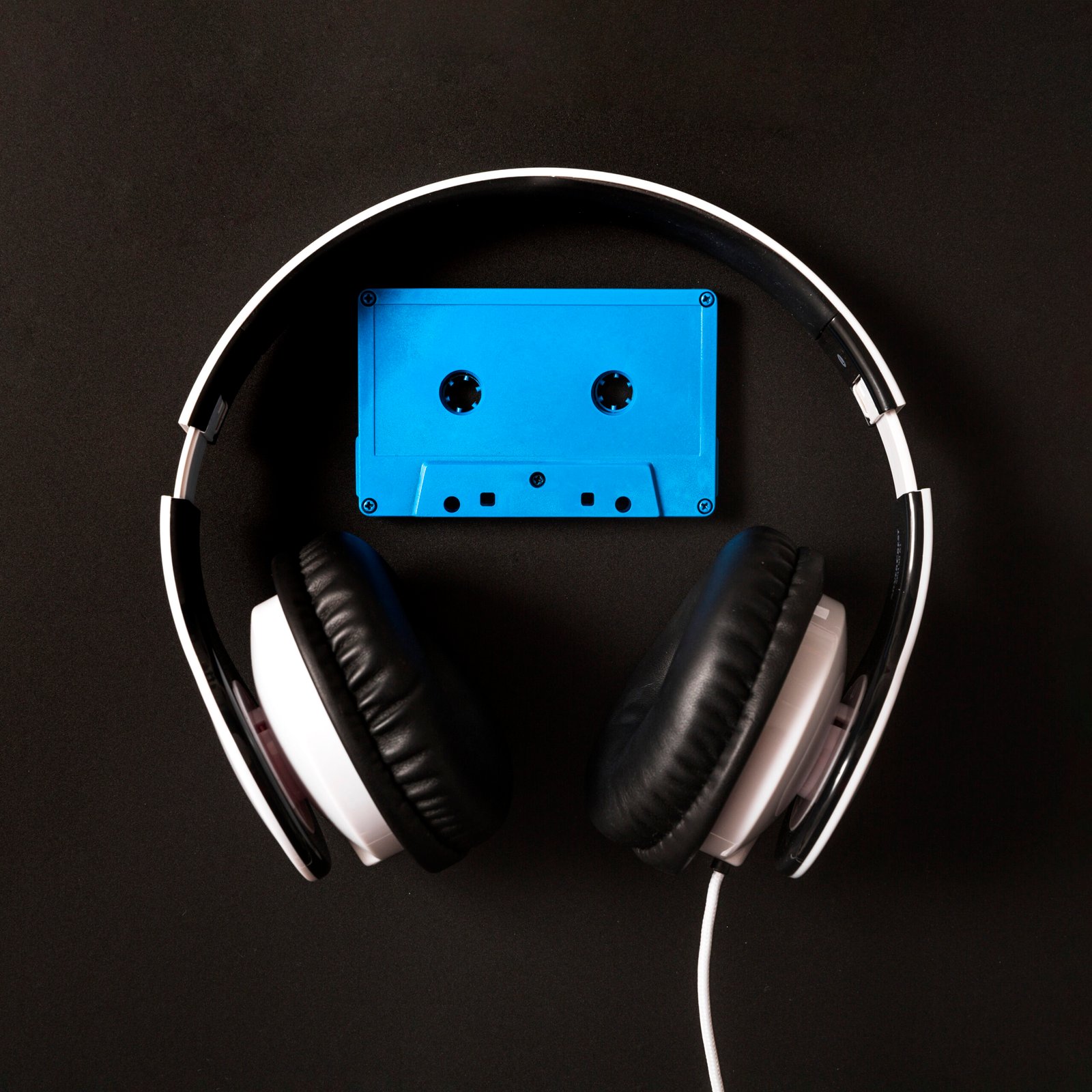 headphone-blue-cassette-tape-black-background